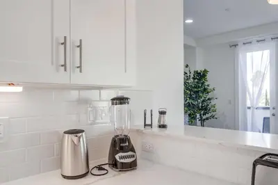a kitchen with a blender on a counter at Park Blvd Paradise 304 New construction, king bed! in San Diego