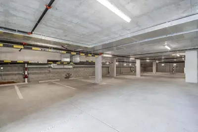 an empty parking lot in an empty parking garage at Park Blvd Paradise 304 New construction, king bed! in San Diego