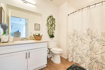 a bathroom with a toilet and a shower curtain at Luxury 2BD 2BA, BRAND NEW/PETS/CLOSE TO EVERYTHING/BOHO+COZY VIBES in San Diego