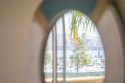 an arched window with a view of a city at Bay Views & Gaslamp/Little Italy/Convention 1BD in San Diego