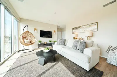 a living room with a couch and a table at NEW Organic Modern Luxury 1BD/1BA- close to everything! in San Diego