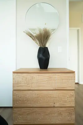 a black vase sitting on top of a dresser at NEW Organic Modern Luxury 1BD/1BA- close to everything! in San Diego