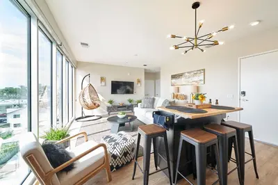 a kitchen and living room with a table and chairs at NEW Organic Modern Luxury 1BD/1BA- close to everything! in San Diego