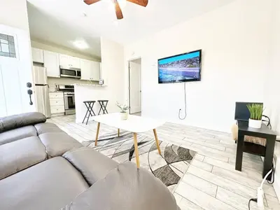 a living room with a couch and a table at Modern Retreat Just Outside The City in San Diego