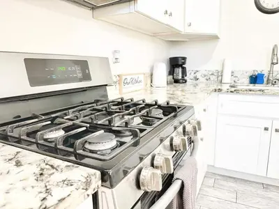 a kitchen with a stove top oven in a kitchen at Modern Retreat Just Outside The City in San Diego