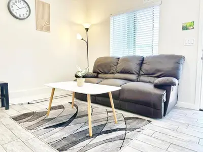 a living room with a couch and a table at Modern Retreat Just Outside The City in San Diego