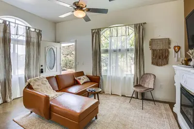 a living room with a couch and a fireplace at Cozy Alpine Cottage Near Casinos and Trails! in Alpine