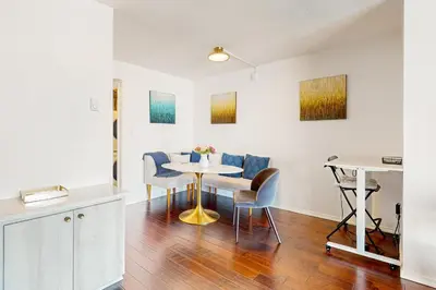 a kitchen and dining room with a table and chairs at Seaside Serenity Haven -30 night min in San Diego