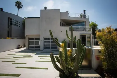 a house with a cactus in front of it at Amazing Views! Walk to the Beach! Pool and Spa! in San Diego