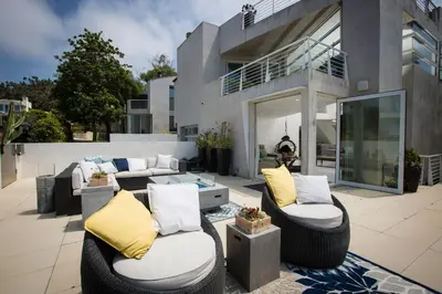 a patio with two couches at Amazing Views! Walk to the Beach! Pool and Spa! in San Diego