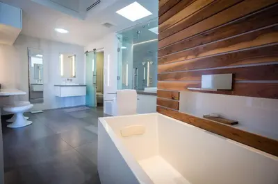 a bathroom with a tub and a toilet and a sink at Amazing Views! Walk to the Beach! Pool and Spa! in San Diego
