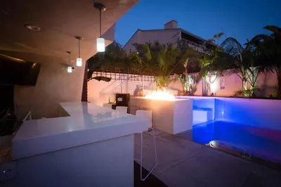 a house with a swimming pool at night at Amazing Views! Walk to the Beach! Pool and Spa! in San Diego