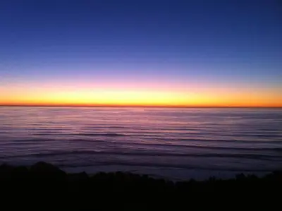 a sunset over a large body of water at Amazing Views! Walk to the Beach! Pool and Spa! in San Diego