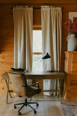 a desk and a chair in a room with a window at Award-Winning A-Frame with Views and Cedar Hot Tub in Julian
