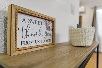 a sign on top of a wooden table at Brand New home in San Diego 3BR Quiet neighborhood near Downtown/Seaworld/Zoo in San Diego