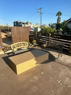 two benches sitting next to each other on a sidewalk at Charming Guest House in SD in San Diego