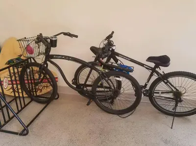 two bikes are parked next to a wall at Sand Pebbles Resort - 1 Bedroom Condo in Great Location Right by the Beaches and Attractions in Solana Beach