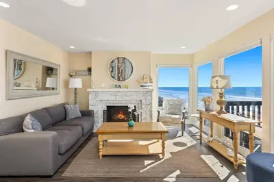 a living room with a couch and a fireplace at Oceanfront Family Getaway - BBQ - Oceanfront Seating in Oceanside