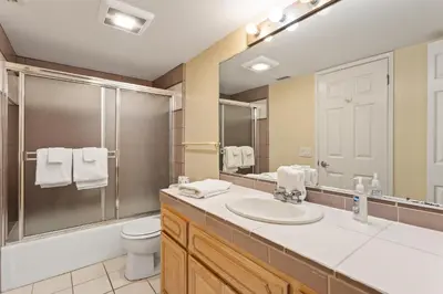 a bathroom with a sink and a toilet and a mirror at Oceanfront Family Getaway - BBQ - Oceanfront Seating in Oceanside