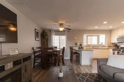 a kitchen and living room with a couch and a table at Not taking reservations in Chula Vista