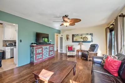 a living room with a couch and a table at Walk To Beach - BBQ - Fire Pit - Outdoor Dining in Carlsbad