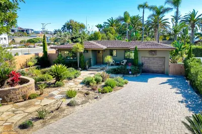 a house with a driveway and a garage at Walk To Beach - BBQ - Fire Pit - Outdoor Dining in Carlsbad