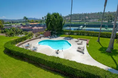 an overhead view of a swimming pool in a park at Private Balcony Overlooking Pool - Gated Parking in Encinitas