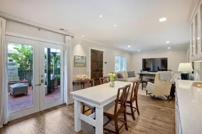 a kitchen and living room with a table and chairs at 90 Walk Score, Steps to Beach, Dining in Carlsbad