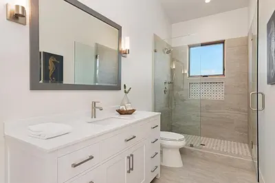a white bathroom with a sink and a shower at Oceanview Rooftop Patio - Walk To The Beach & Park in Carlsbad