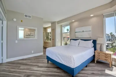 a bedroom with a bed and a window at 3BR Oceanview, Gated Community & Parking, Elevator in Oceanside