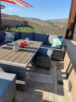 a picnic table and bench on a patio at Acres of Bliss - A hillside getaway in Ramona