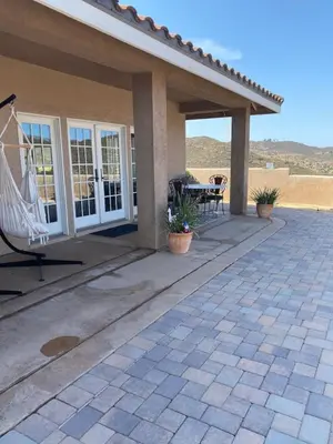a porch of a house with a patio at Acres of Bliss - A hillside getaway in Ramona