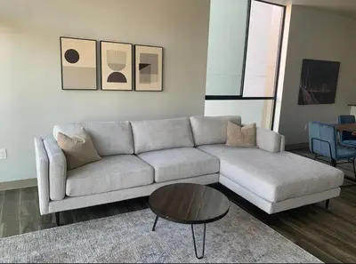 a living room with a couch and a coffee table at Modern 2-Bedroom Apartment in Little Italy in San Diego