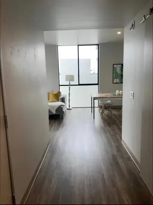 a living room with a couch and a table at Modern 2-Bedroom Apartment in Little Italy in San Diego