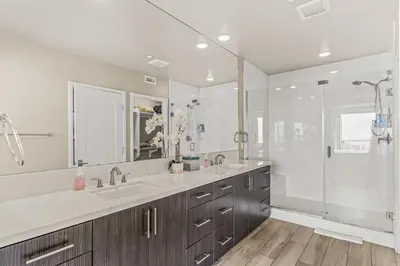 a bathroom with two sinks and a shower at Oceanside Escape 700S-102 in Oceanside