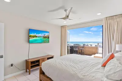 a bedroom with a bed and a view of the ocean at Oceanside Oasis 700S-103 in Oceanside