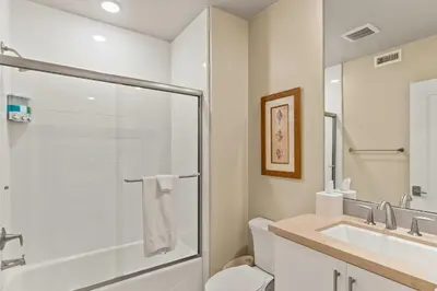 a bathroom with a shower and a toilet and a sink at Oceanside Oasis 700S-103 in Oceanside