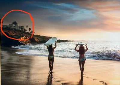two women are standing on the beach with surfboards at Sur La Mer, beachfront, tidal pools in San Diego