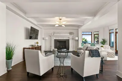 a living room with white furniture and a fireplace at La Jolla Cove-Oceanfront 5600SF 3BR+Loft 5BA House best Villiage location walk everywhere in San Diego