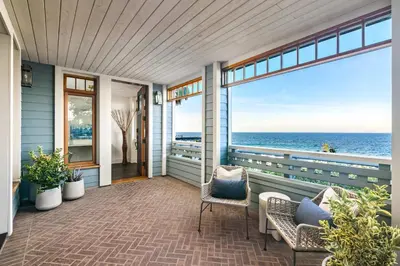 a balcony with chairs and a view of the ocean at La Jolla Cove-Oceanfront 5600SF 3BR+Loft 5BA House best Villiage location walk everywhere in San Diego
