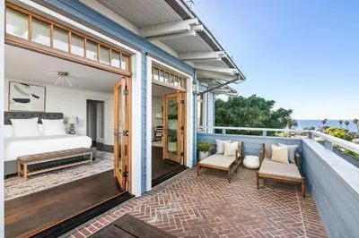 a balcony of a house with a bed and a bedroom at La Jolla Cove-Oceanfront 5600SF 3BR+Loft 5BA House best Villiage location walk everywhere in San Diego