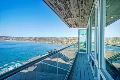 a balcony with a view of the ocean at Panoramic Ocean Vistas With Hot Tub and Firepit in San Diego