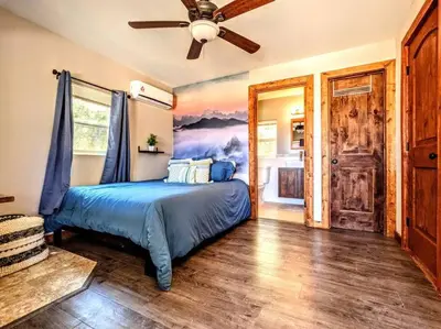 a bedroom with a bed and a ceiling fan at #7 Josie's Mountain Top Hideout-Cabin in the Woods in Santa Ysabel