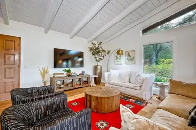 a living room with two chairs and a table at City Getaway, Hot Tub, Fire Pit, Game Room, BBQ, Hiking Trails, Vineyard Views, B-Ball in Fallbrook