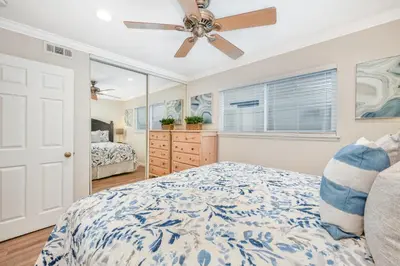 a bedroom with a bed and a ceiling fan at Three Bedroom Home on 36th with Indoor Outdoor Living in Newport Beach