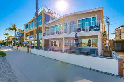 a building on the beach next to a street at Bayside 1 in San Diego