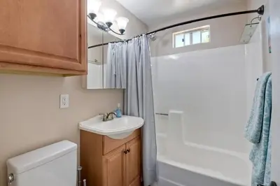 a small bathroom with a sink and a toilet at Nice home, Ocean views, and open space views. in Oceanside