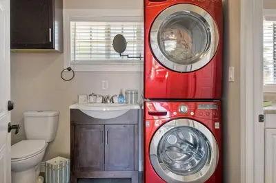 a washing machine and a washer in a bathroom at Nice home, Ocean views, and open space views. in Oceanside