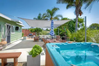a backyard with a swimming pool and a house at Nice home, Ocean views, and open space views. in Oceanside