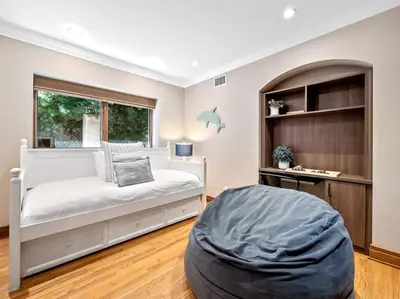 a bedroom with a bed and a large window at Ocean-View Mountaintop Getaway. Jacuzzi/Ping-Pong! in San Diego
